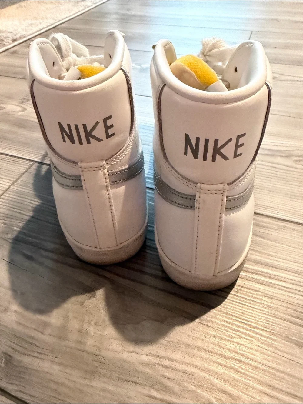 Nike White High-Top Sneakers with Gray Swoosh